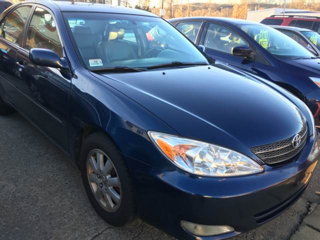 2004 Toyota Camry for sale at Capelo's Auto Sales in Woburn MA