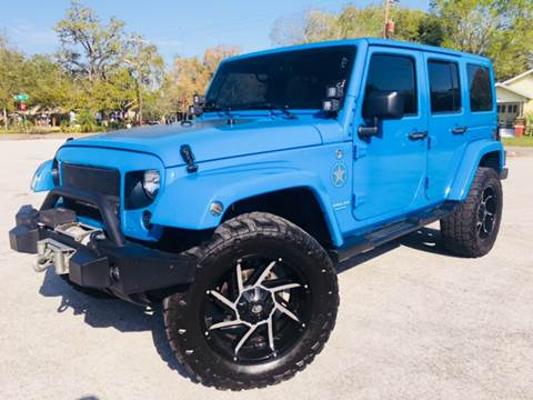 2012 Jeep Wrangler Unlimited for sale at LUXURY AUTO MALL in Tampa FL