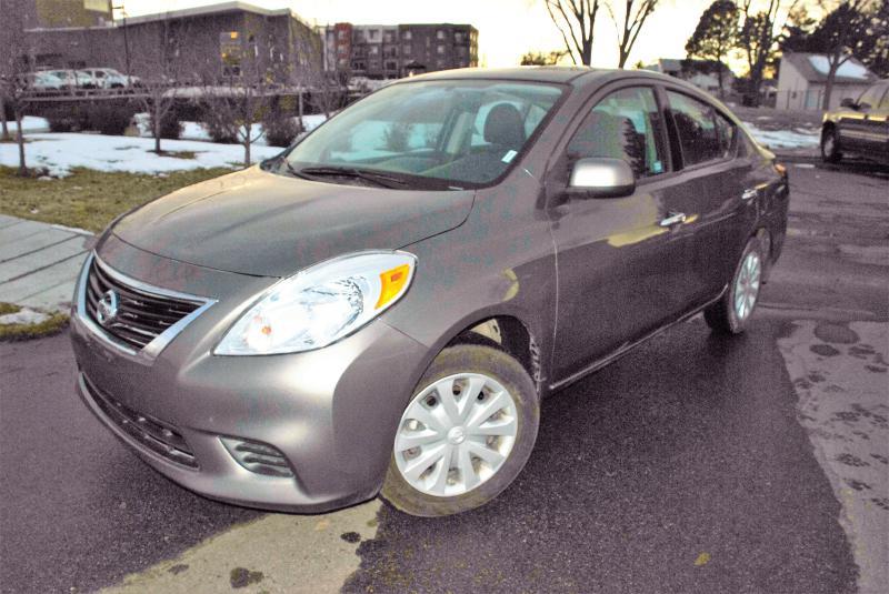 2014 Nissan Versa for sale at Rods Cars Inc. in Denver CO