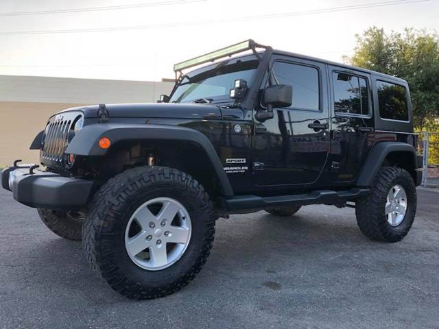 2013 Jeep Wrangler Unlimited for sale at FAST LANE AUTO SALES in San Antonio TX