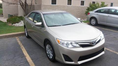 2014 Toyota Camry for sale at QUEST MOTORS in Centennial CO