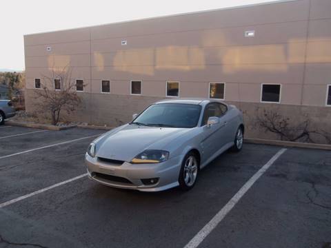 2006 Hyundai Tiburon for sale at QUEST MOTORS in Englewood CO