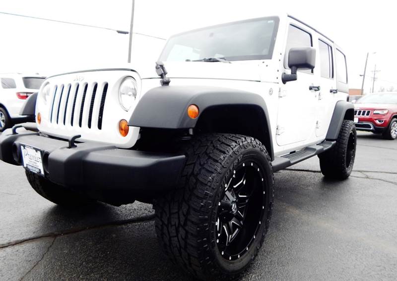 2013 Jeep Wrangler Unlimited for sale at PREMIER AUTO SALES in Carthage MO