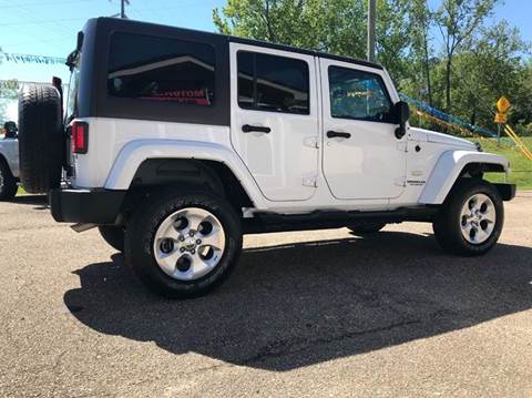 2013 Jeep Wrangler Unlimited for sale at MAULDIN MOTORS LLC in Sumrall MS