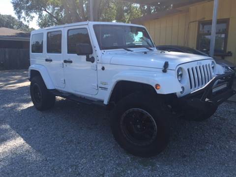 2014 Jeep Wrangler Unlimited for sale at SW AUTO LLC in Lafayette LA
