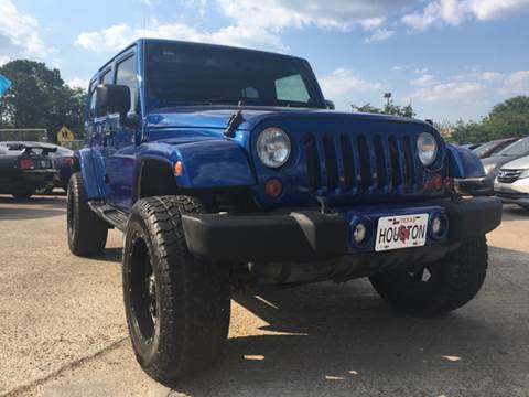 2009 Jeep Wrangler Unlimited for sale at SUPER DRIVE MOTORS in Houston TX