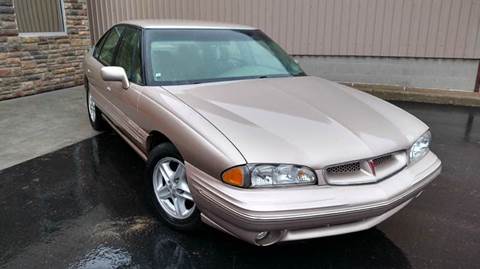 1999 Pontiac Bonneville for sale at PRISED AUTO in Gladstone MI